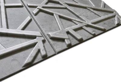 A close-up, angled view of two textured, gray wall panels with a geometric pattern, set against a white background.