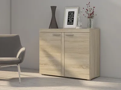 A modern living room setting with a chair and a cabinet.