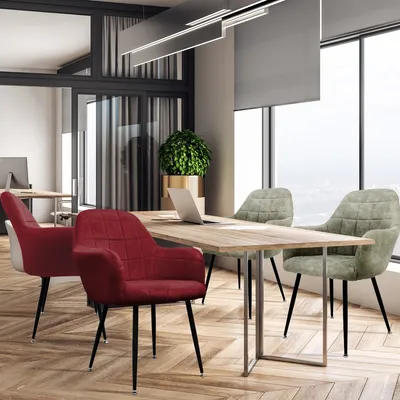 A modern office meeting room with a table and chairs.
