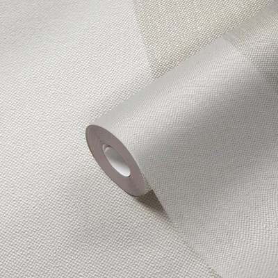A roll of wallpaper is shown in close-up, with a textured surface and a subtle geometric pattern.
