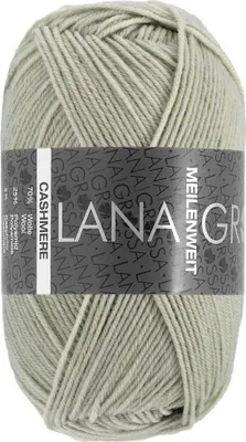 A ball of light green yarn with a label wrapped around it.