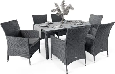 A dark gray rattan dining set with a glass-topped table and six chairs, set against a white background.