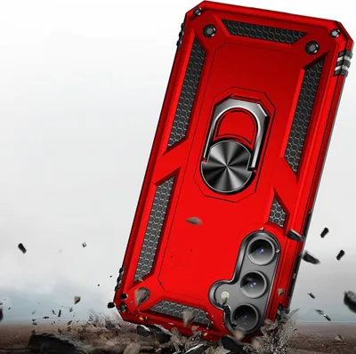 A red phone case with a ring holder is shown in a dynamic, action-oriented scene with debris flying around it, suggesting durability and protection.