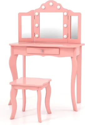 A pink vanity table and stool set with lights on the mirror.