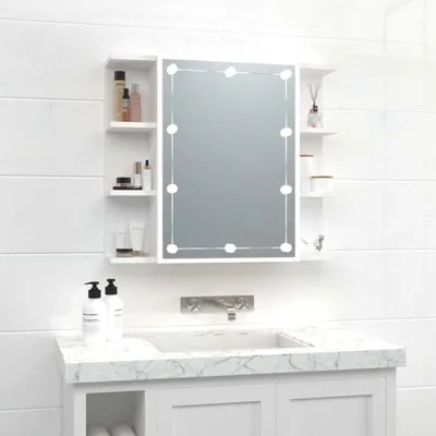A bathroom vanity with a mirror cabinet and sink.