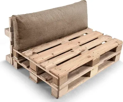 A sofa cushion set made from wooden pallets and a light brown cushion.