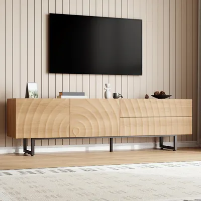 A wooden TV stand with a textured front is shown in a room with a wall-mounted TV.