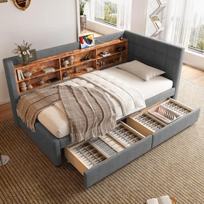 A bedroom scene with a daybed, shelves, and storage drawers.