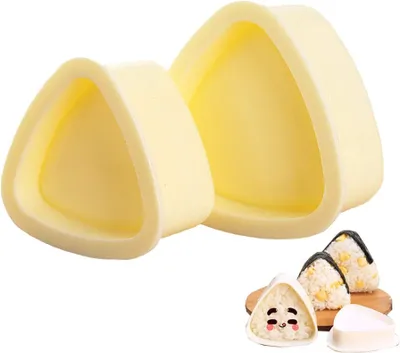 Two triangular onigiri molds are shown on a white background, with two finished onigiri rice balls in the foreground.