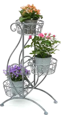 A three-tiered metal plant stand with potted plants.