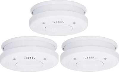 Three white smoke detectors are arranged in a triangular formation against a white background.
