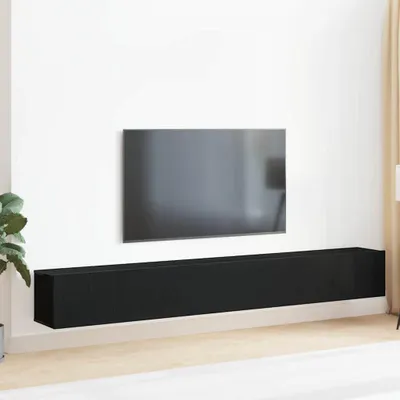 A black TV cabinet mounted on a white wall below a television.