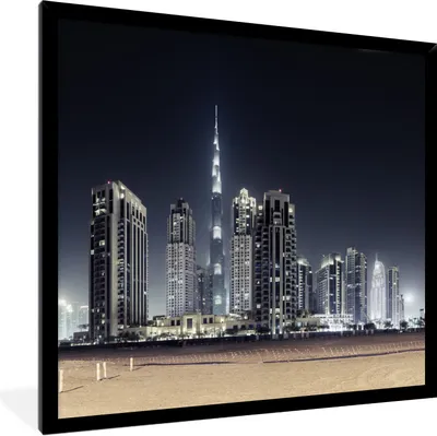 Produktbild von MuchoWow® Gerahmtes Poster Der Burj Khalifa erhellt den Himmel über Dubai mit anderen Wolkenkratzern 40x40 cm - Poster mit Schwarzem Bilderrahmen Wandposter Rahmen Foto Bilder - Mit Rahmen - Wanddekoration Schlafzimmer