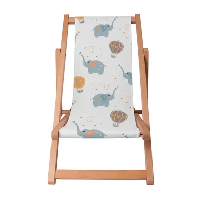 A wooden deck chair with a white fabric seat featuring a pattern of blue elephants and hot air balloons.