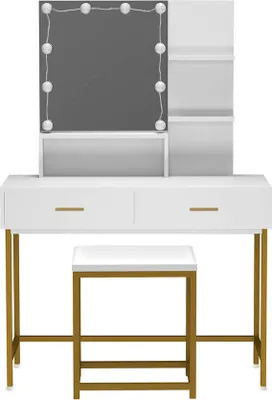 A white vanity table with gold legs and a lighted mirror, along with a matching stool.