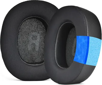 Two black ear pads for headphones are shown, with one cut away to reveal its internal layers.