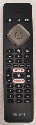 A black Philips remote control is shown against a light gray background.