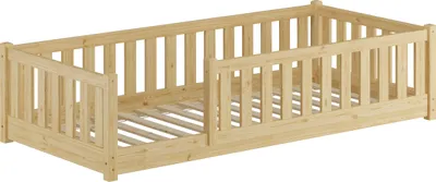 A wooden children's bed with safety rails on three sides, shown from a diagonal angle against a white background.