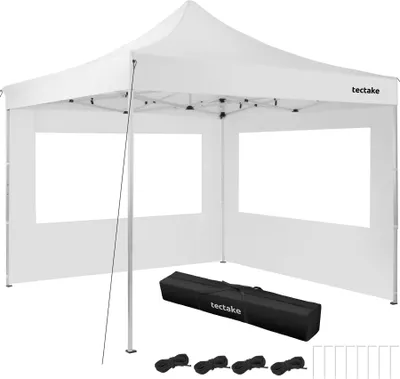 A white pop-up tent with windows and accessories laid out in front of it.