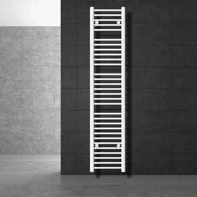 A white towel radiator is mounted on a black tiled wall, with a gray tiled wall and floor in the background.