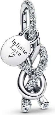 A close-up studio shot of a silver charm with cubic zirconia stones and an engraved oval tag.