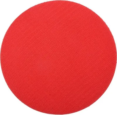A close-up, top-down view of a red circular sanding pad.