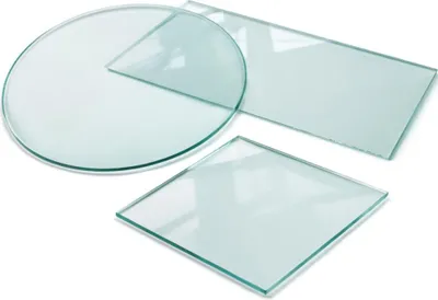 Three pieces of glass: a round one, a rectangular one, and a square one, are arranged on a white background.