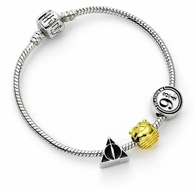 Zdjęcie produktu dla Opaska na ramię Harry Potter Uni Symbole wielokolorowa Standard