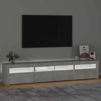 A modern TV stand with LED lighting in a living room setting.