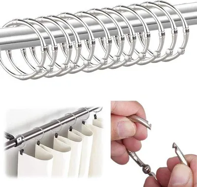 Productafbeelding van Unyqoos® Zilverkleurige metalen douchegordijnringen met kliksluiting – set van 12, geschikt voor douche- en standaardgordijnstangen, roestbestendig