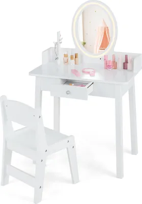 A white wooden vanity table and chair set for children, with a lighted mirror and accessories.
