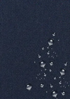 A close-up of dark blue fabric with water droplets on it.