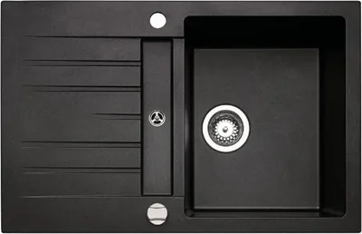 A top-down view of a black granite kitchen sink.