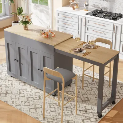 A kitchen island with an extendable table and stools in a bright, modern kitchen setting.