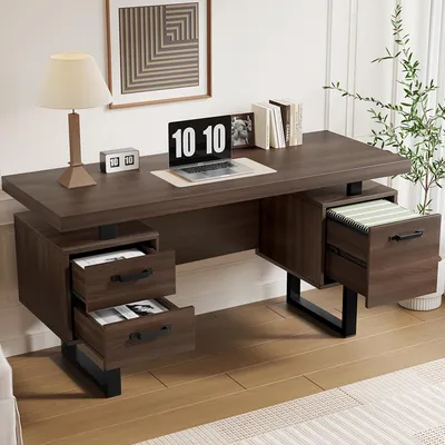 A modern office desk setup with a laptop, lamp, and books.