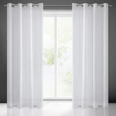 A pair of white sheer curtains hanging in front of a window.