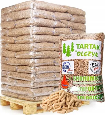 A pallet of bagged wood pellets with a single bag in the foreground showing product details.