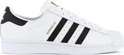 A side view of a white Adidas Superstar sneaker with black stripes and gold lettering.