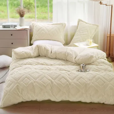 A cozy bedroom scene with a plush comforter set.