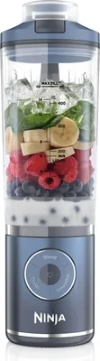 A Ninja Blast Max BC251EUNV compact battery blender with ingredients for a smoothie inside the blender jar.