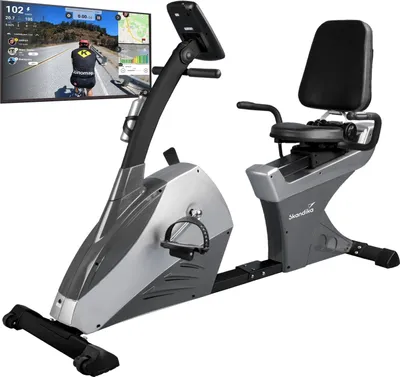 A recumbent exercise bike with a screen displaying a cycling simulation.