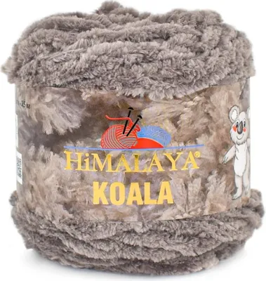A ball of fluffy yarn with a label showing the brand and product name.