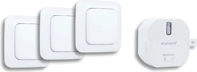 A set of three white light switches and a white receiver unit are arranged on a white background.