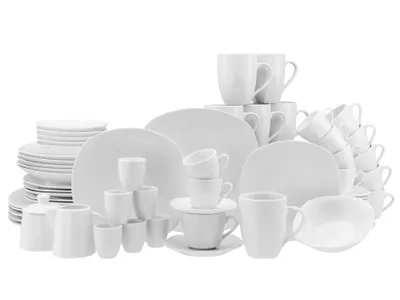 A collection of white ceramic dishes and cups arranged on a white background.
