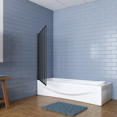 A modern bathroom with a white bathtub and a black shower screen.