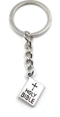 Imagen del producto de Llavero metálico con diseño de la Biblia, ideal como amuleto de la suerte, presentado en una caja de regalo de aluminio. Perfecto para regalar