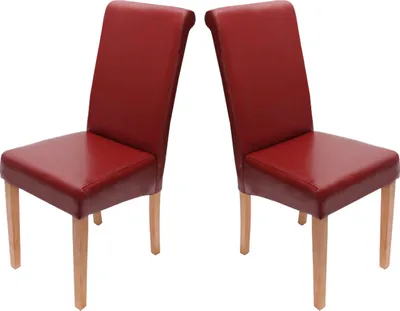 Two red dining chairs with light wooden legs are shown against a white background.