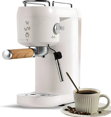 A white electric coffee machine with a wooden handle, shown with a cup of coffee and coffee beans.
