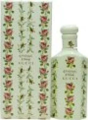 A bottle of perfume and its packaging, both decorated with a floral pattern.