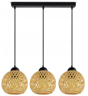 A triple pendant light fixture with bamboo shades.